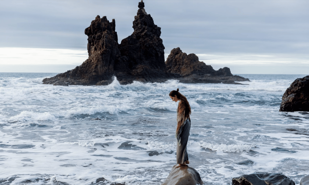 woman standing near ocean