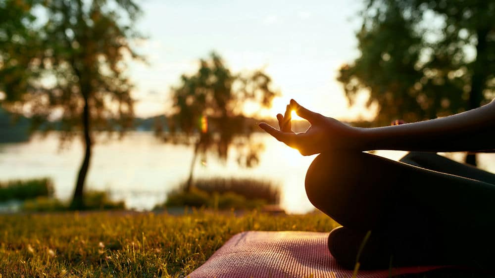 a-woman-meditating-in-the-park