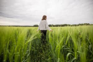 a-woman-in-the-fields-smiling