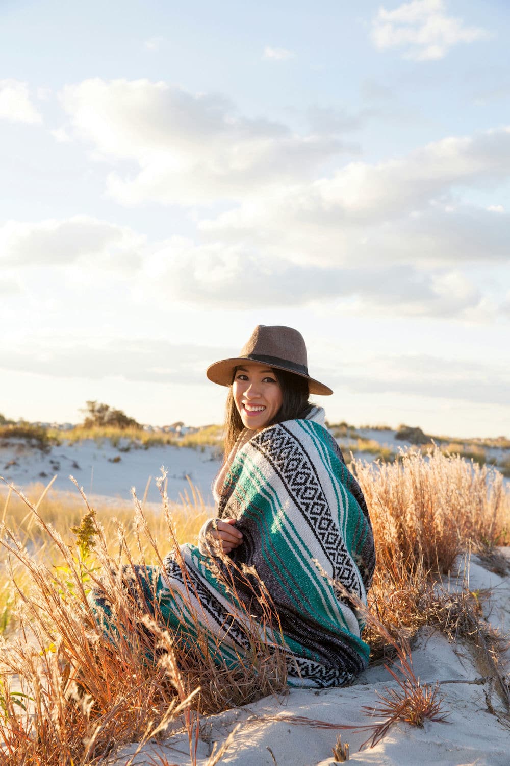 a-woman-smiling-on-the-beach