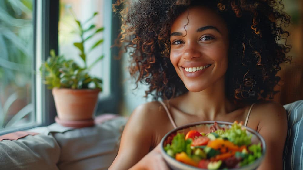 woman holding a bowl of salad