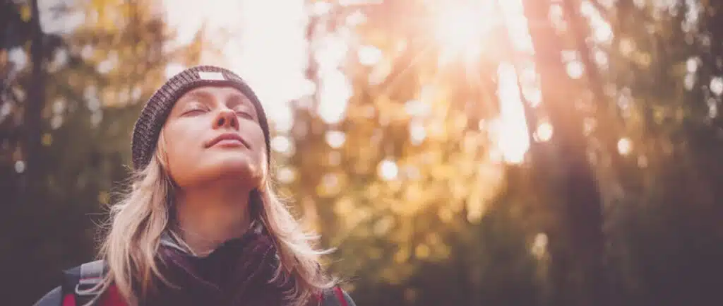 a-woman-meditating-in-the-forest