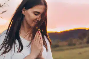 a-woman-praying-outside