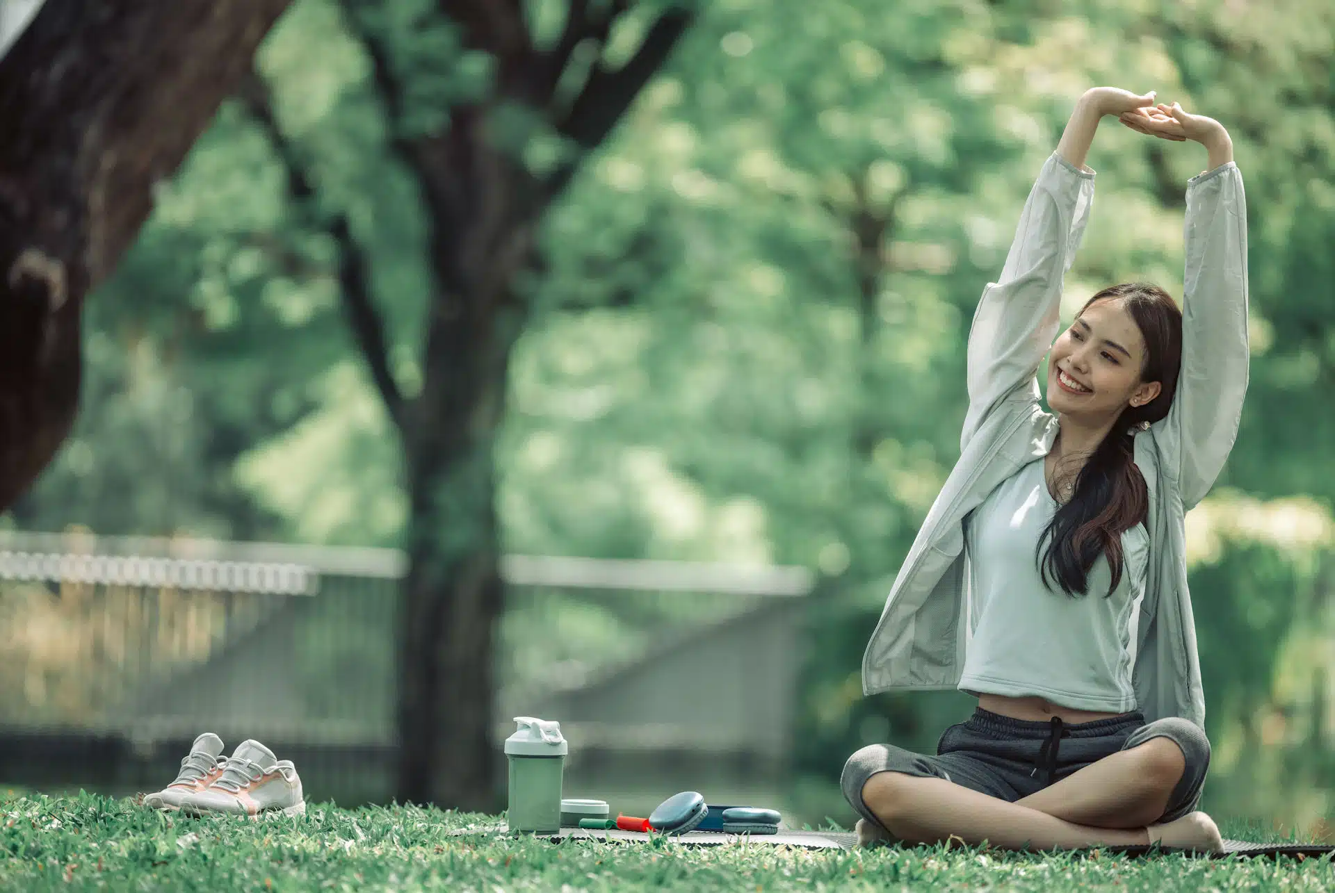 woman stretching at the park