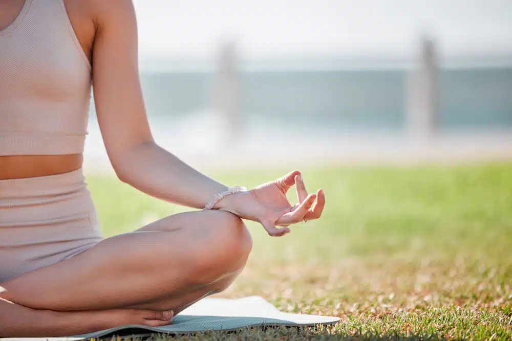 a-woman-outside-meditating