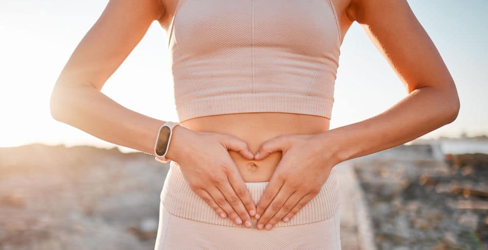 a-woman-making-a-heart-over-her-stomach