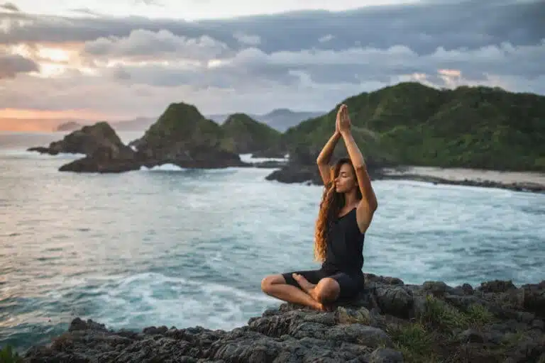 woman-practicing-yoga-on-the-beach