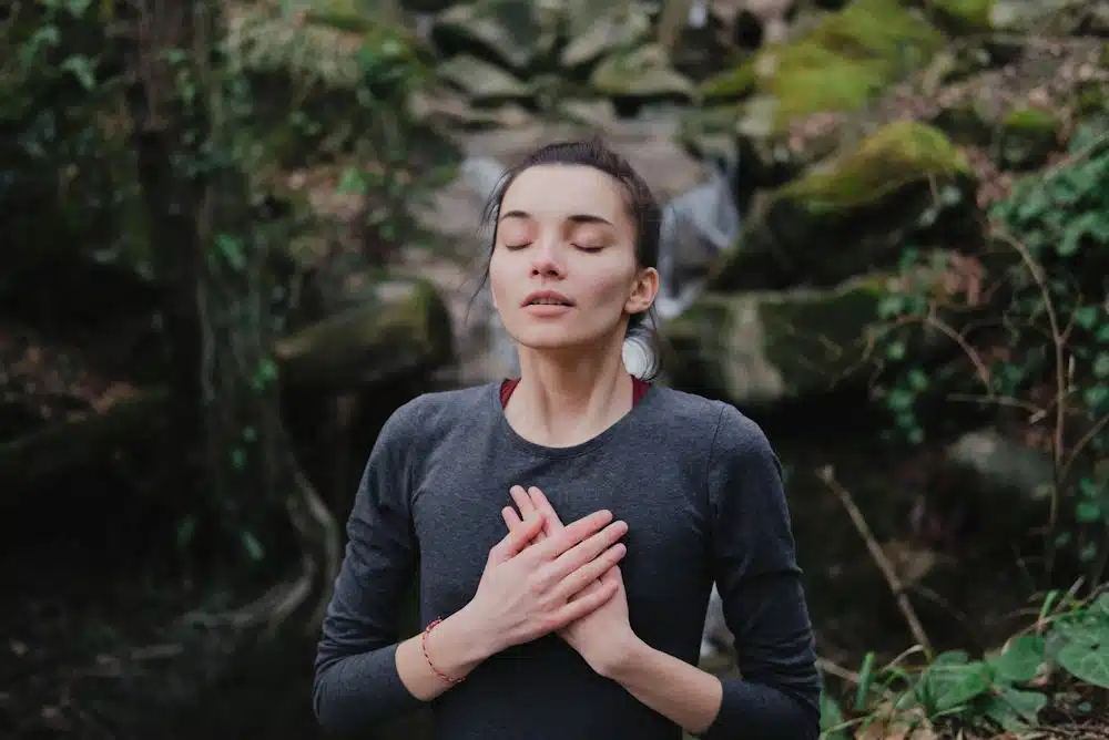 a-woman-meditating-in-nature2