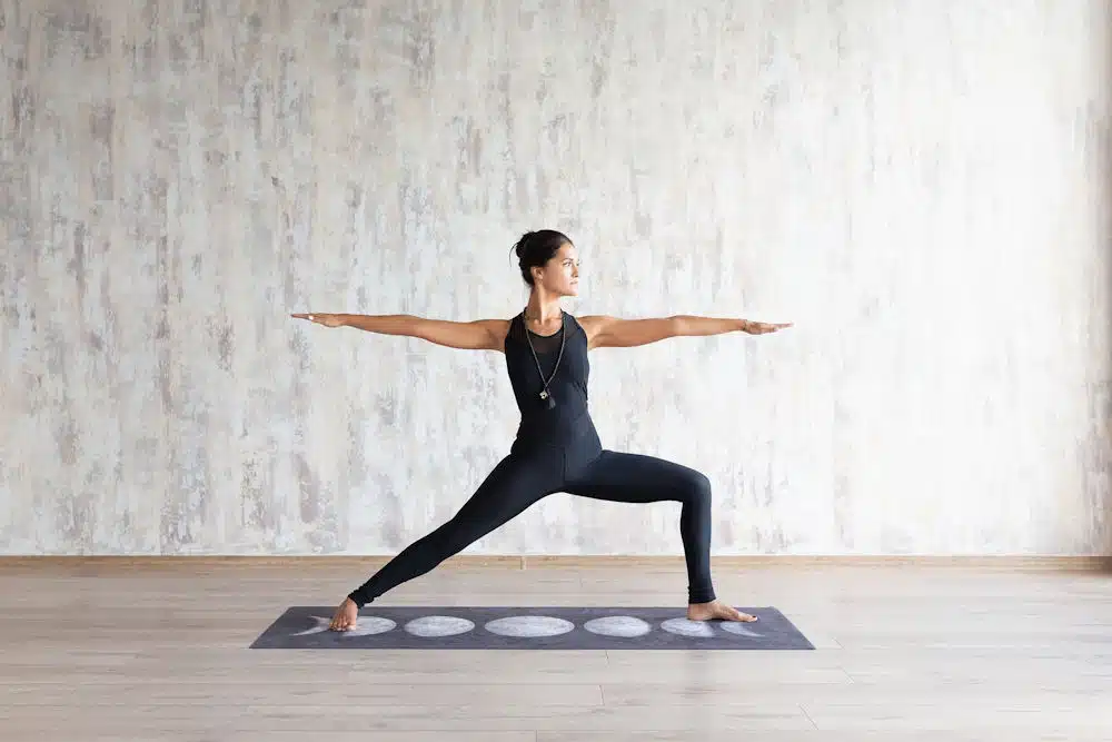 a-woman-practicing-yoga-on-a-yoga-mat