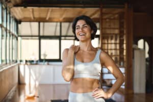 a-woman-smiling-after-participating-in-yoga