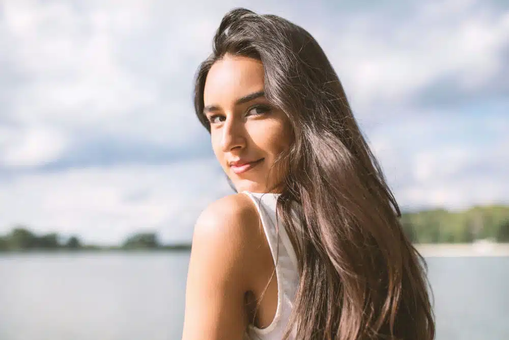 a-woman-smiling-in-nature