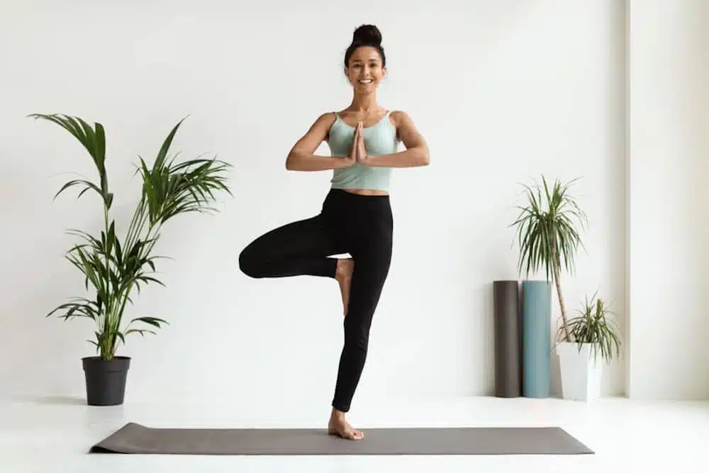 a-woman-practicing-yoga-and-self-love-at-home